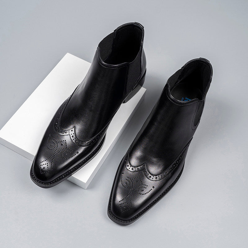 Black leather Chelsea dress boots with elastic side gore and perforated brogue detailing