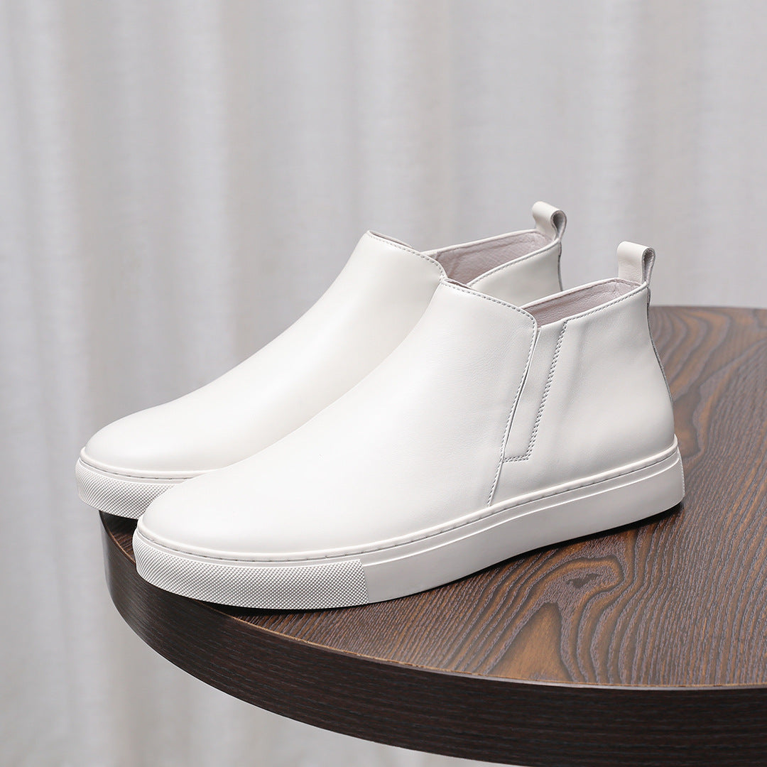 White leather pointed-cap toe side-zip dress boots with textured rubber sole