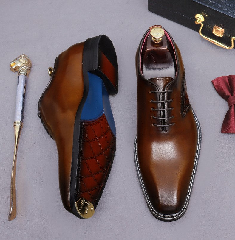 Brown wingtip brogue oxford shoes with chunky lug sole and lace-up front