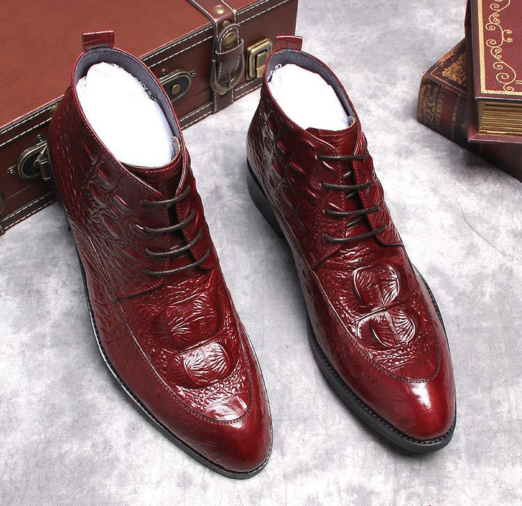 Men's burgundy lace-up dress boots with wingtip brogue detailing, glossy textured leather
