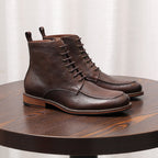 Pair of brown leather lace-up ankle boots with side zipper and stitched outsole