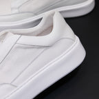 Men's genuine leather sneakers in white, stitched side panel and thick white sole.