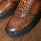 Brown leather low-top sneakers, lace-up front with perforated detailing and rubber sole