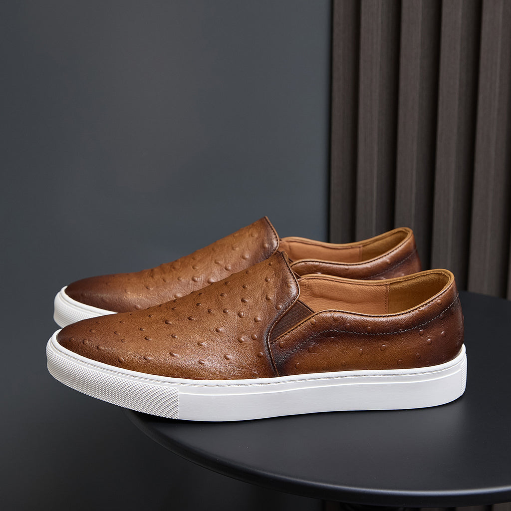 Men's brown leather slip-on sneakers with perforated upper and white rubber sole