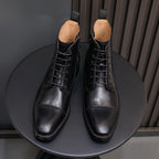 Men's black leather pointed-toe dress boots with lace-up front and back pull tabs