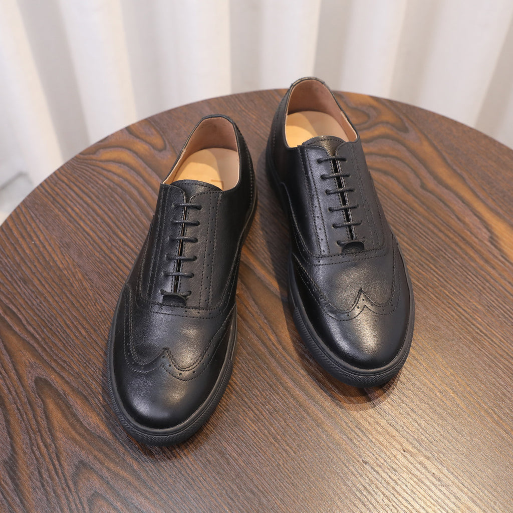 Men's black leather sneakers, pair view with tan-lined interior and lace-up