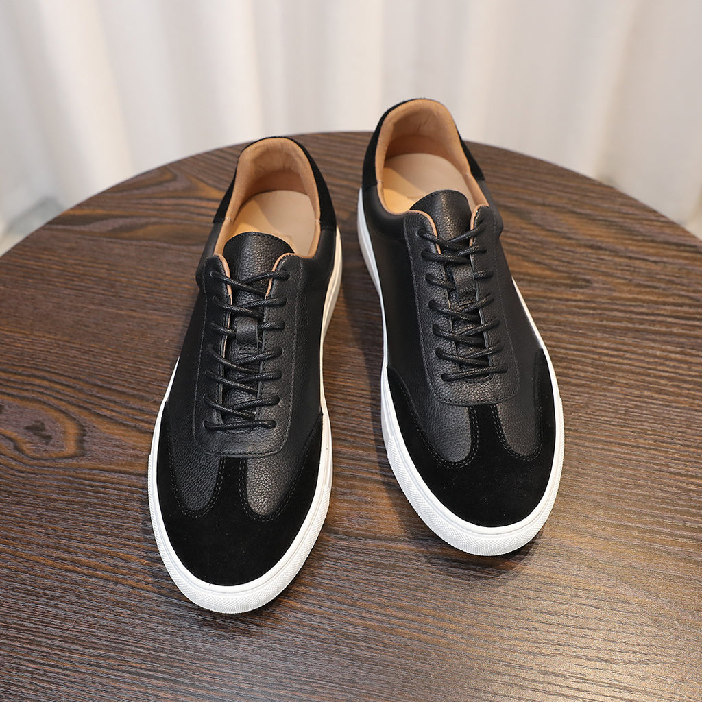 Men's black leather sneakers with lace-up closure, contrast sole and cushioned lining