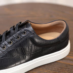 Men's black genuine leather sneakers, lace-up with padded collar and white sole.