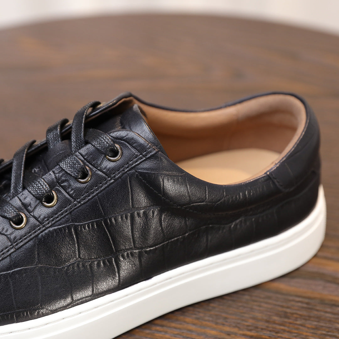 Men's black genuine leather sneakers, lace-up with padded collar and white sole.