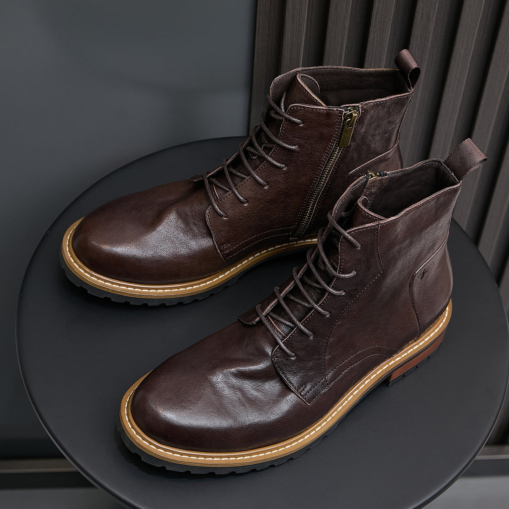 Dark brown leather cap-toe boots with lace-up front and side zip, tan welt detail