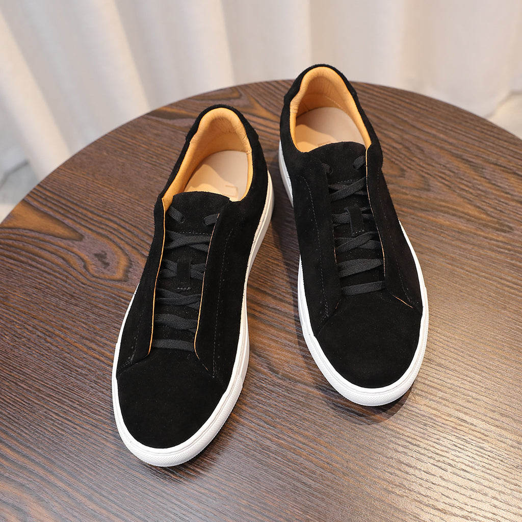 Men's black suede low-top sneakers with lace-up design and white rubber sole