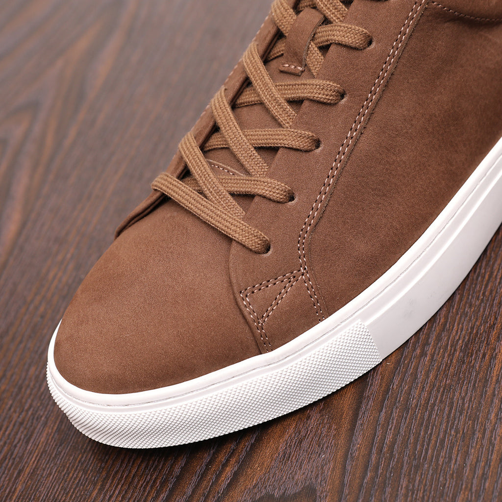 Brown suede leather sneaker with lace-up front and white rubber sole detail