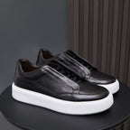 Men's genuine leather sneakers in black with lace-up vamp and white platform sole.