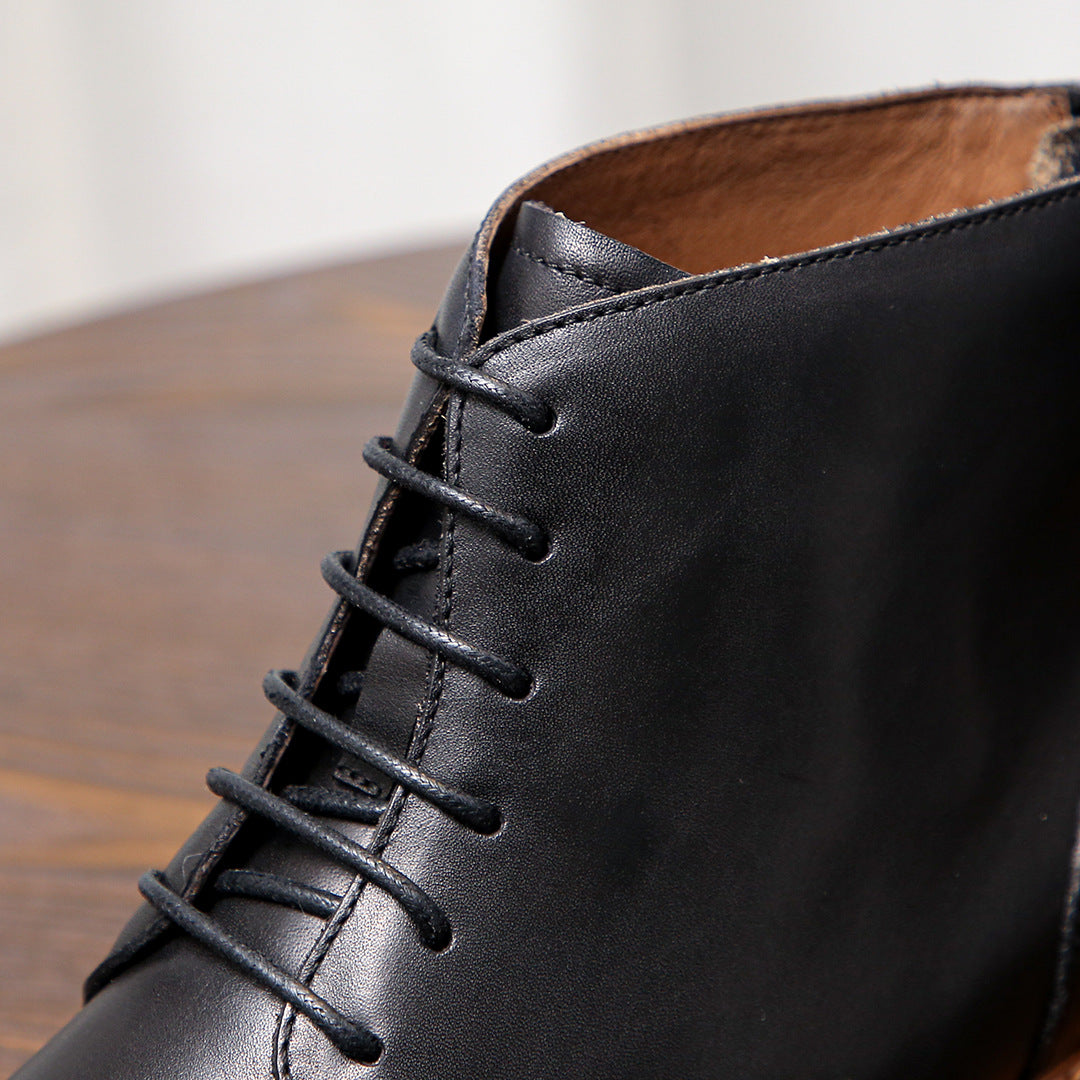 Black leather boot upper with lace-up design and visible stitching detail