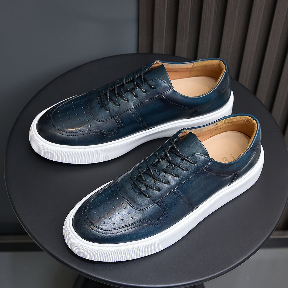 Men's navy leather lace-up sneakers, low profile with white sole and side panels