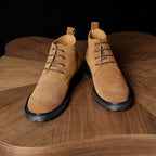 Men's chukka boots tan suede, front angle view with lace-up and chunky tread sole
