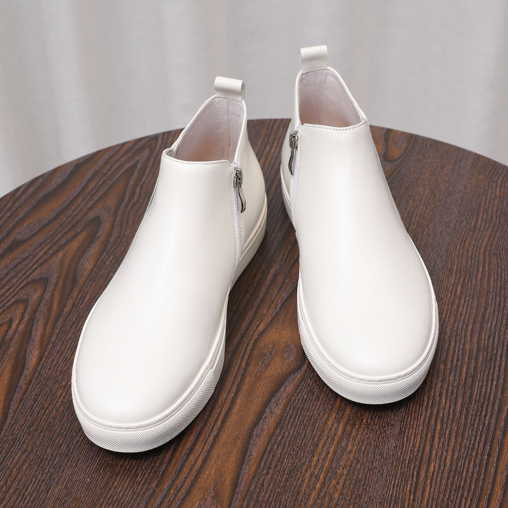 White leather side-zip ankle boots with pointed toe and white platform sole