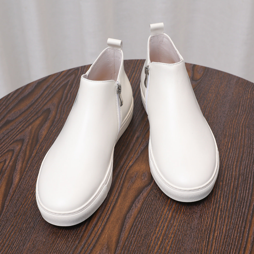 White leather side-zip ankle boots with pointed toe and white platform sole