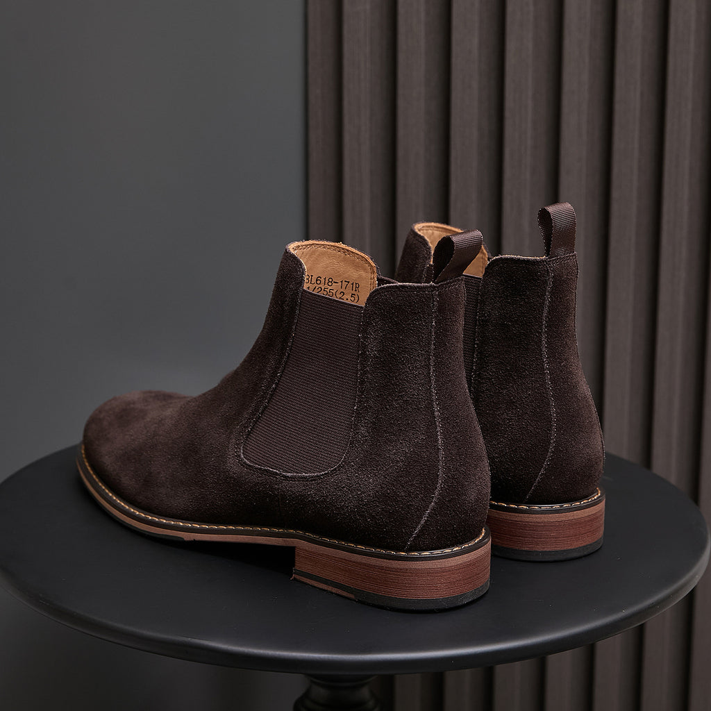 Back view of pointed-toe suede Chelsea dress boots, dark brown, showing heel and elastic goring