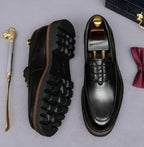Men's chunky lug-sole oxfords in black, outsole view with rugged tread and trim