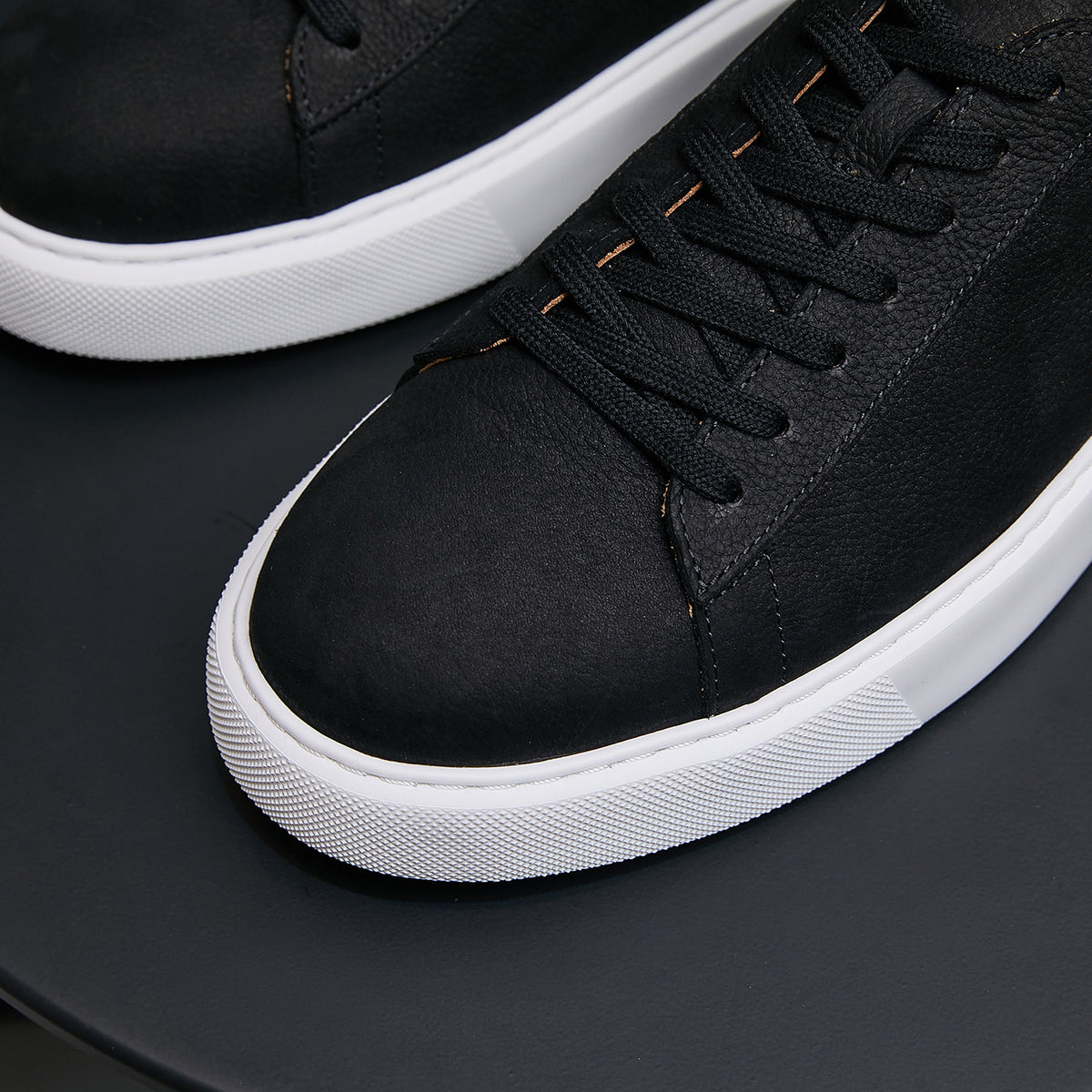 Men's genuine leather sneakers, black, stitched toe and lace-up front with white trim