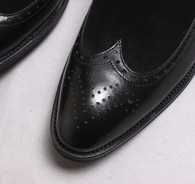 Men's black leather Chelsea dress boot with brogue perforated toe and textured outsole