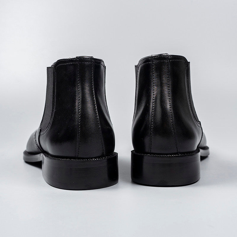 Black genuine leather chelsea dress boots, rear view with stacked heel