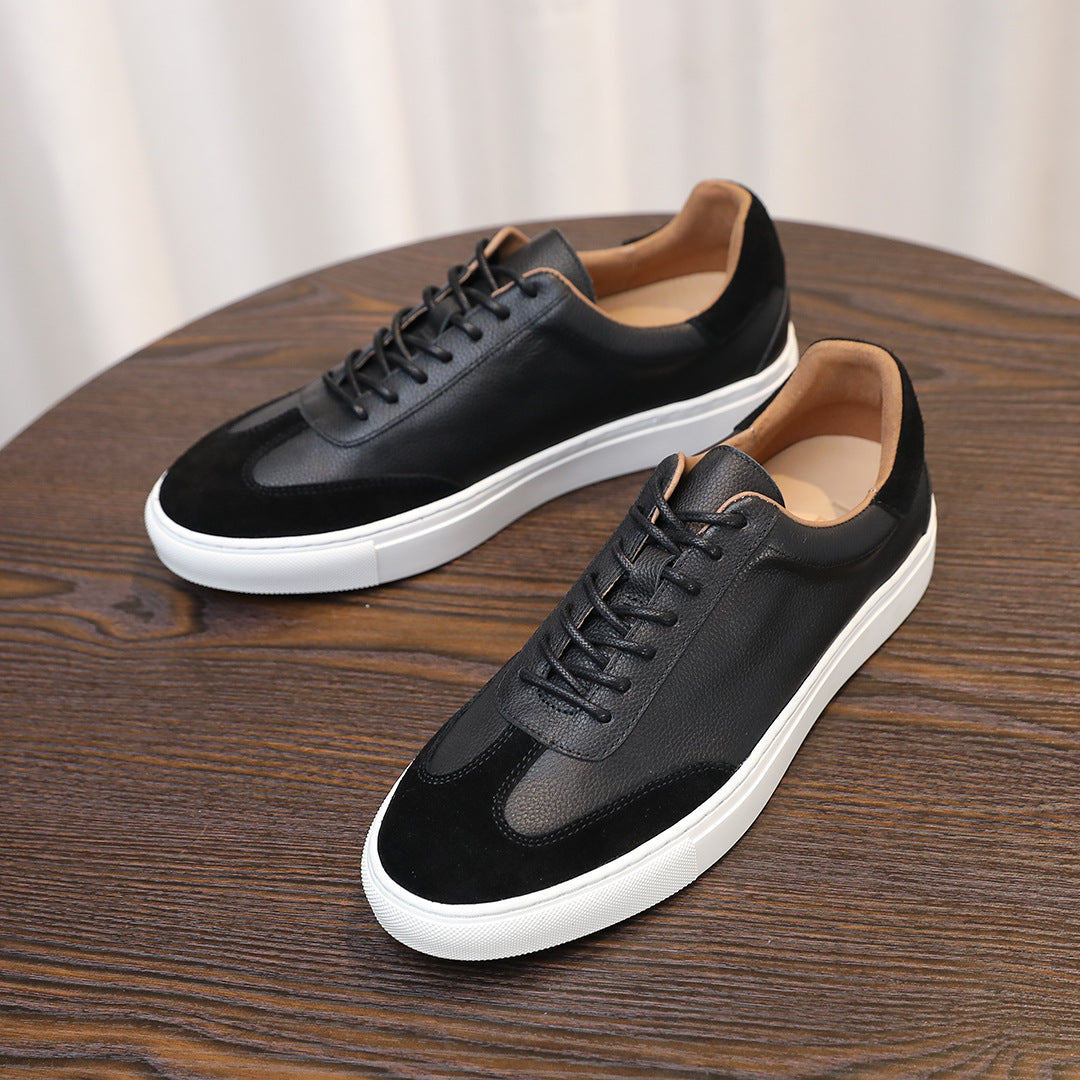 Men's black leather low-top sneakers with laces and white rubber sole platform