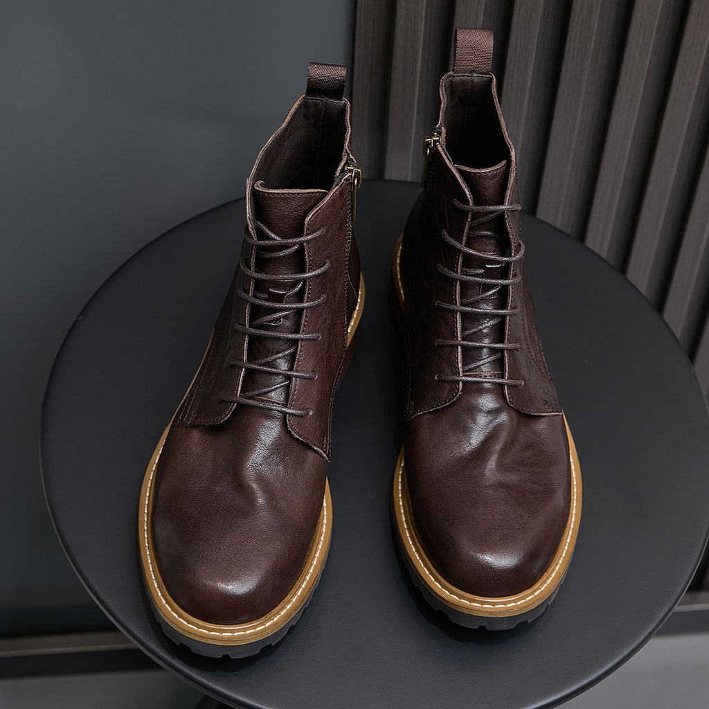 Pair of dark brown leather ankle boots, lace-up with side zip and tan welt stitching