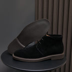 Men's plain-toe lace-up chukka boots in black suede with contrast welt stitching