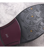 Black Chelsea boot outsole with patterned tread and stitched edge detail