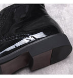 Black glossy leather boot toe and thick sole edge