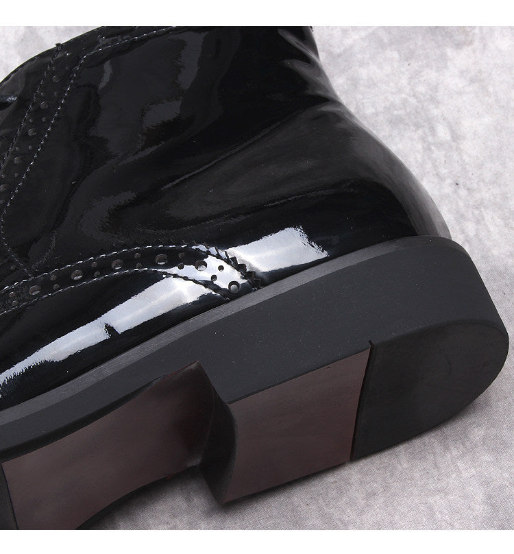 Black glossy leather boot toe and thick sole edge