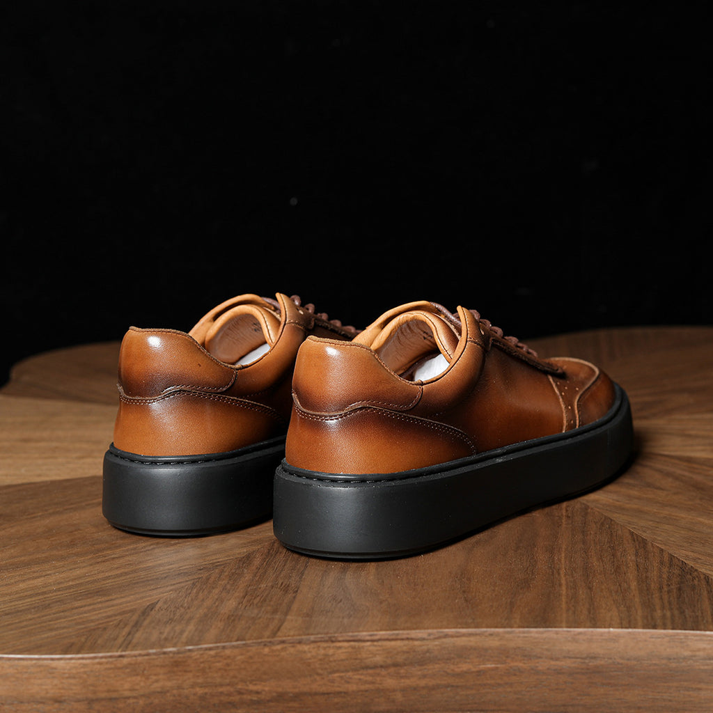Brown genuine leather sneakers, rear view with padded collar and chunky rubber sole