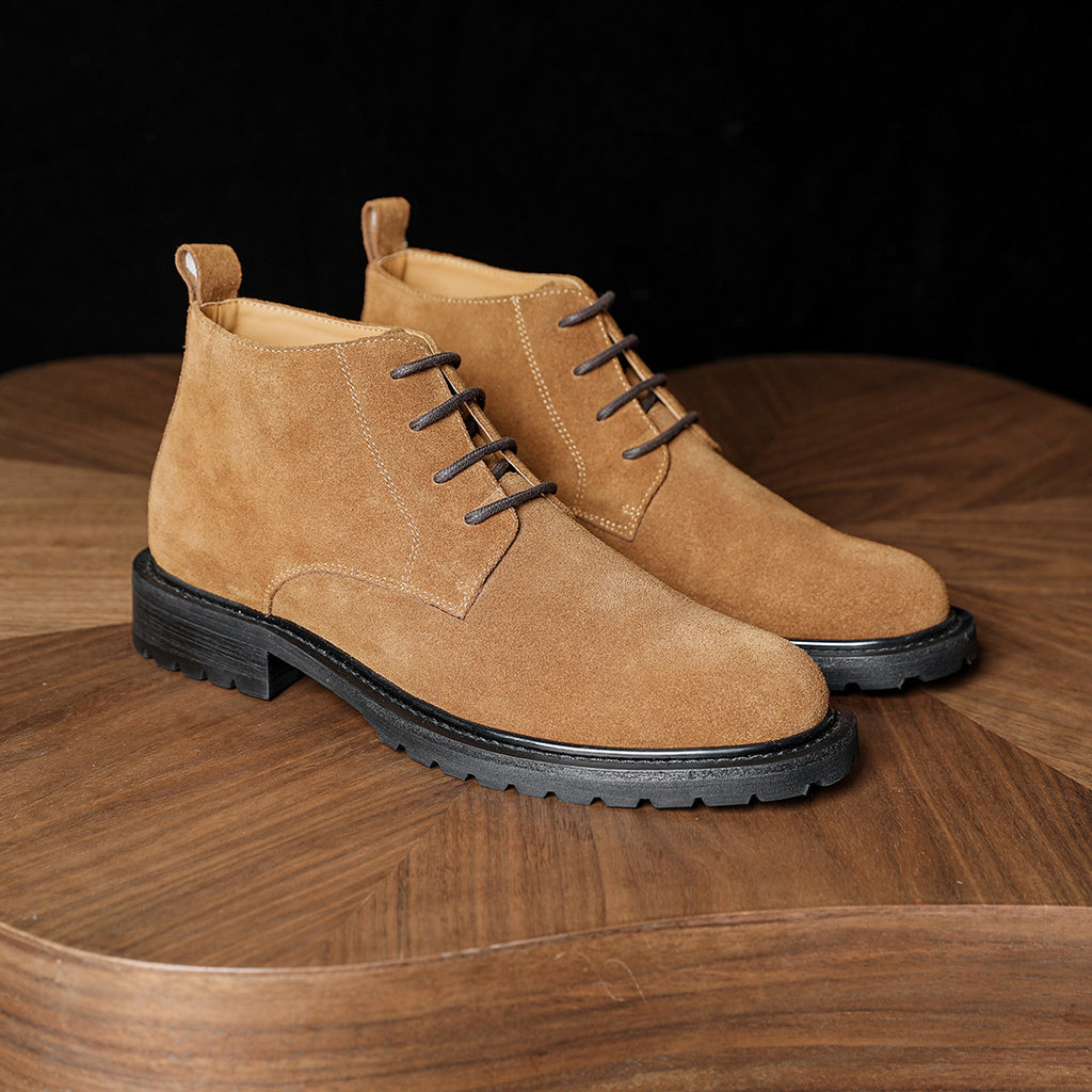 Men's chukka boots tan suede, side view pair with lace-up eyelets and flat sole