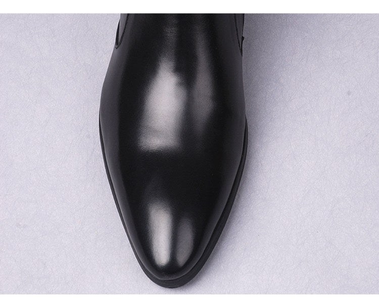 Men's black leather ankle boots with pointed toe and thick sole