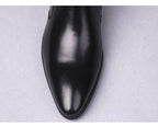 Men's black leather ankle boots with pointed toe and thick sole
