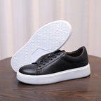 Men's black leather sneakers, outsole visible with white tread and low profile