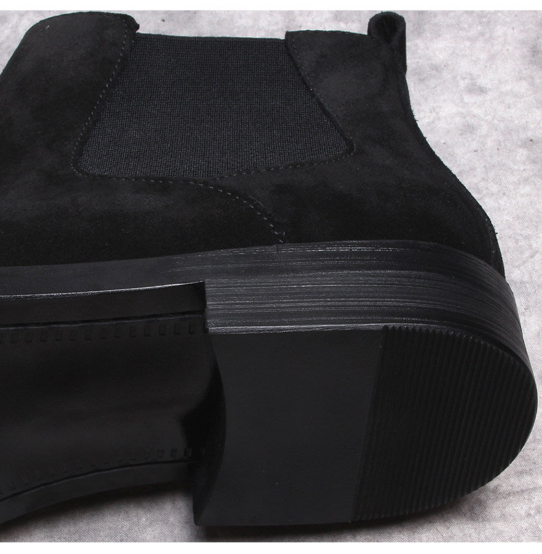 Men's black Chelsea dress boots, side view with low block heel
