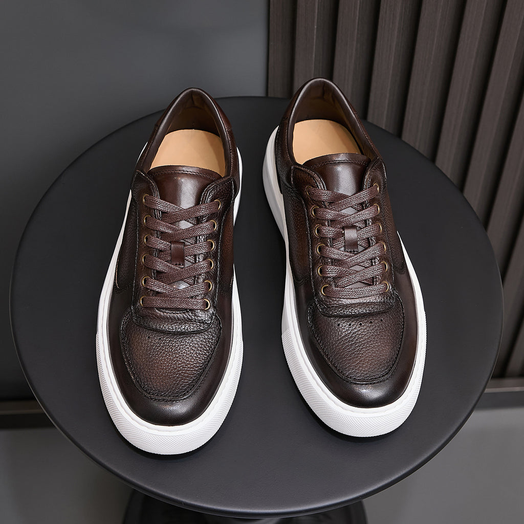 Men's dark brown leather lace-up sneakers on a pair view with white platform sole