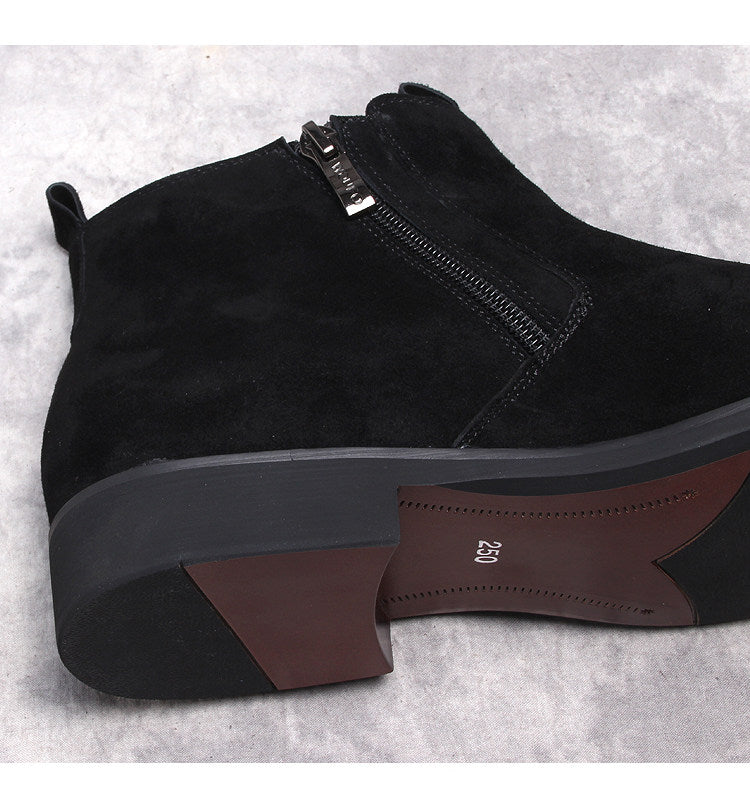 Black suede side-zip boot showing thick sole edge and front zipper closure.