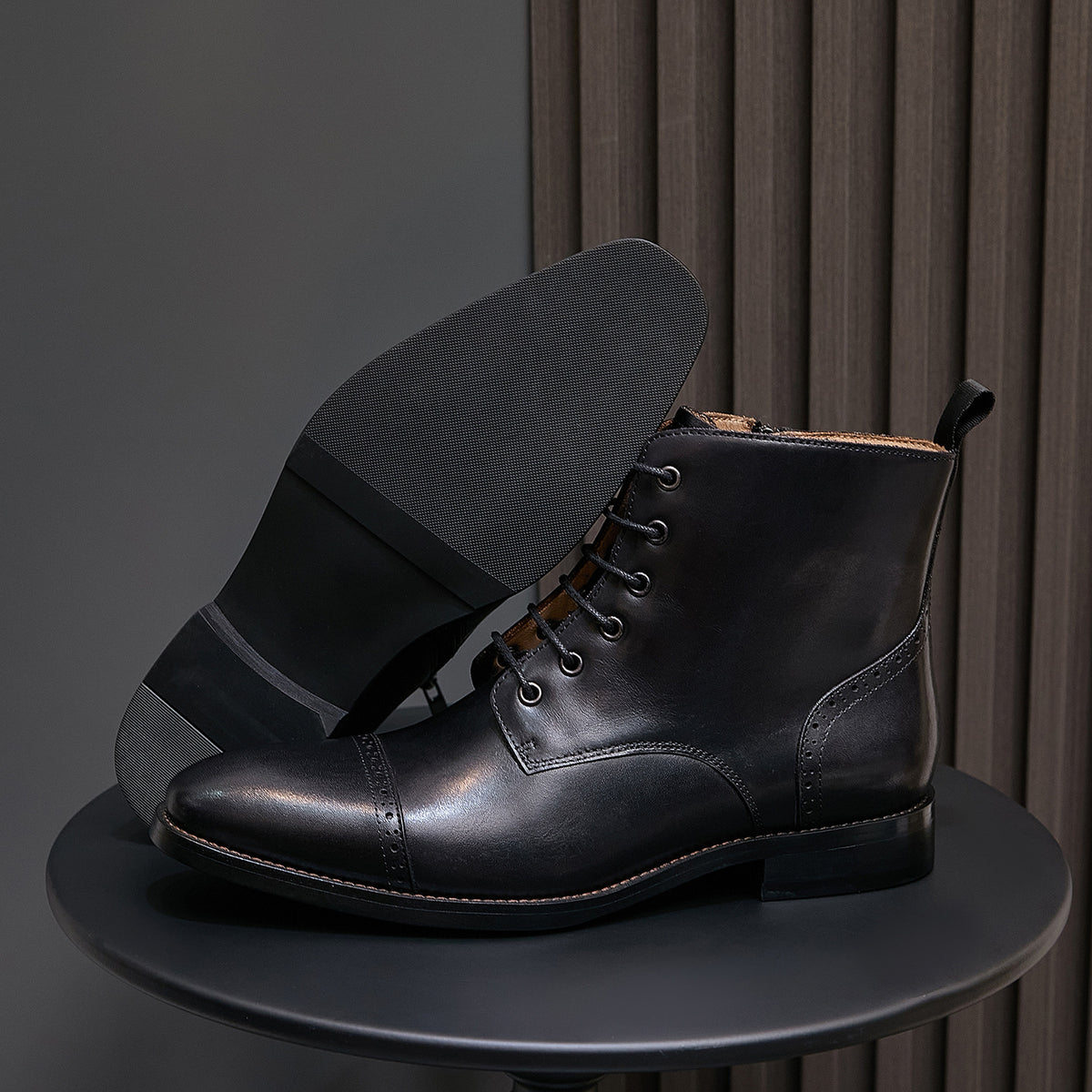 Men's black leather pointed-toe dress boots with lace-up front and side zip