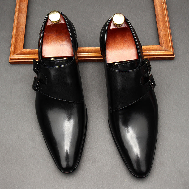 Detailed view of polished black leather and dual metal buckles on BOMEI dress shoes