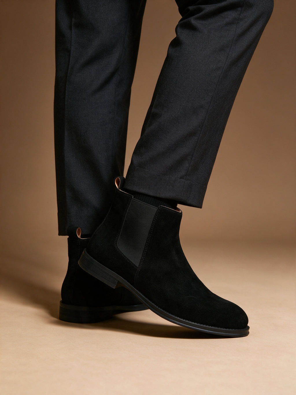 Black suede pointed-toe Chelsea dress boots with side elastic panels and low heel