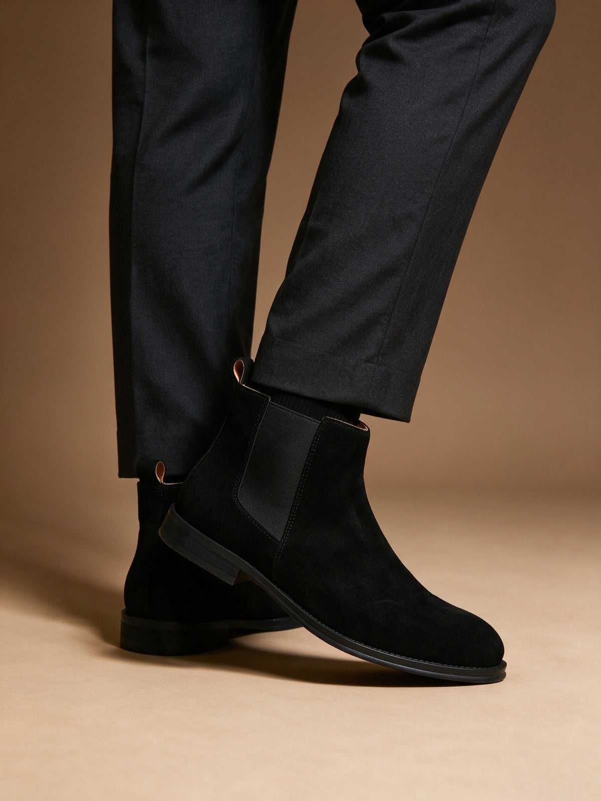Black suede pointed-toe Chelsea dress boots with side elastic panels and low heel