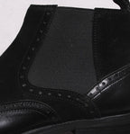 Men's black leather Chelsea boot with elastic side panel and stitched upper seam detail