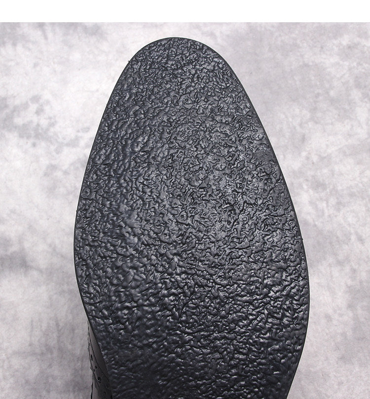 Black boot outsole with textured tread pattern