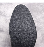 Black boot outsole with textured tread pattern