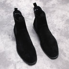 Black suede Chelsea dress boots, pair view with pull tabs and low heels