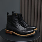 Men's black leather lace-up ankle boots with pointed toe and side zipper.
